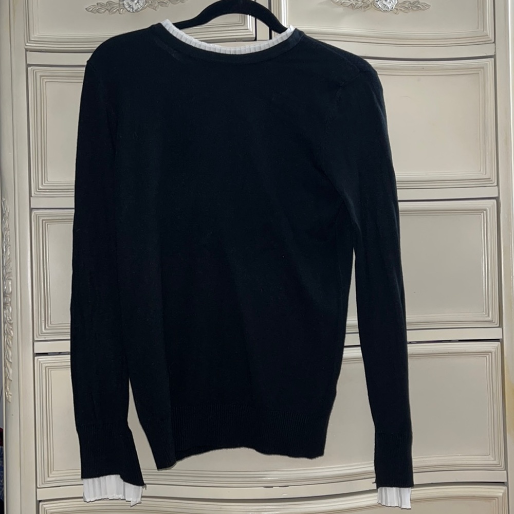 Black sweater with white detailing